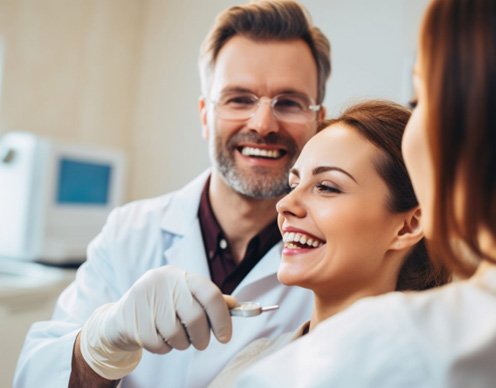 Female seeing dentist and smiling about results 