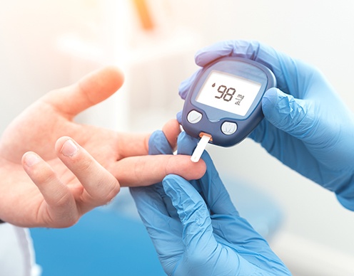 Doctor checking patient's diabetes numbers