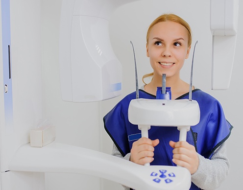 Woman receiving 3 D C T cone beam x-ray scan