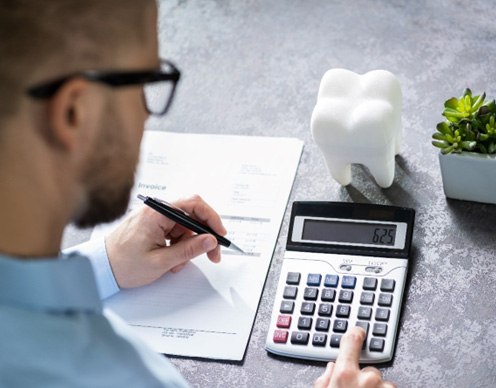 Patient calculating his dental costs  