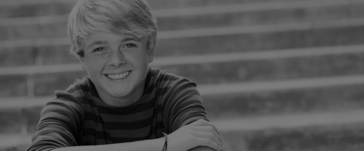 Young boy smiling after children's dentistry visit