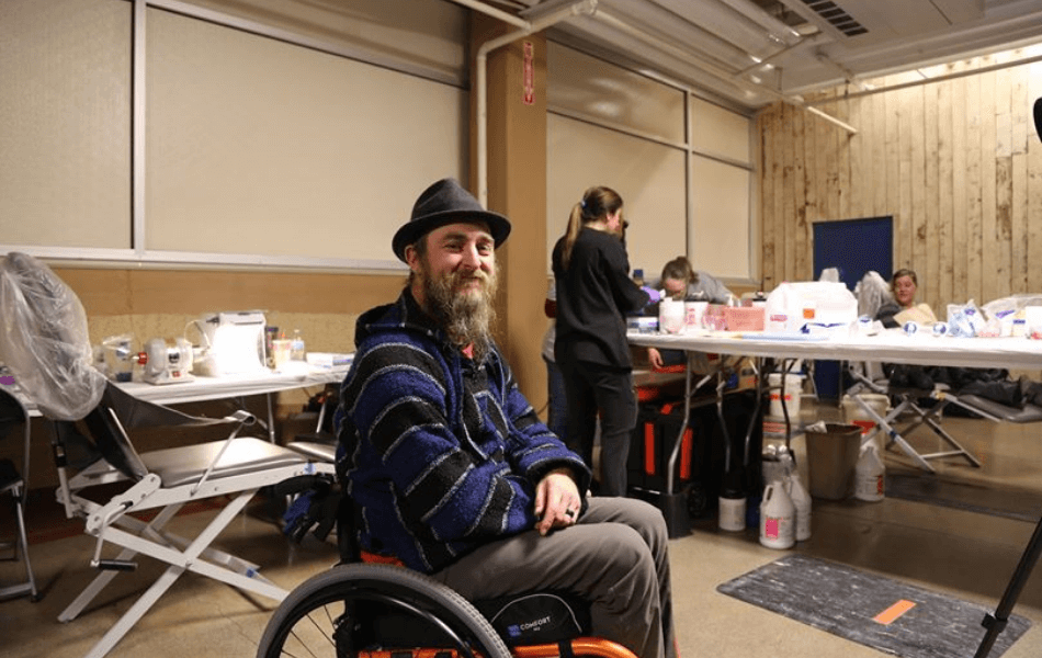 Smiling dental patient at community oral health event