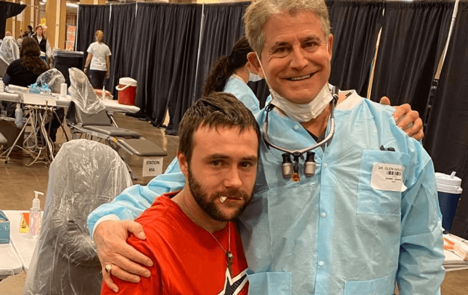 Doctor Goldstein and patient at dental health event