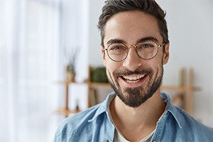 Young man smiles with dental implant sin Randolph