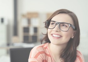 Woman with perfectly aligned smile after Invisalign clear braces