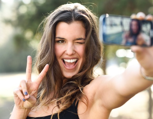 Woman showing off smile after cosmetic dentistry