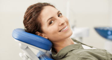 Woman smiling during preventive dentistry visit