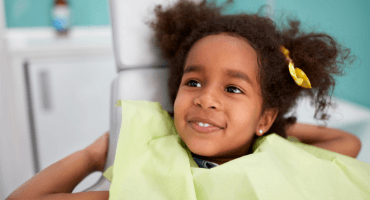Little girl smiling during children's dentistry visit