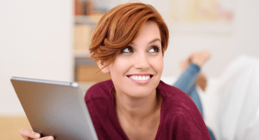 Woman smiling after periodontal disease treatment