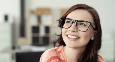 Young woman smiling after orthodontics treatment