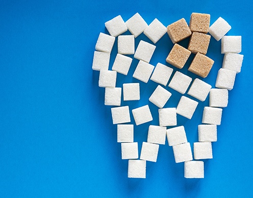 Tooth shape made of sugar and bread cubes