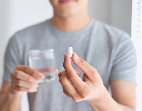 Patient taking oral conscious dental sedation pill