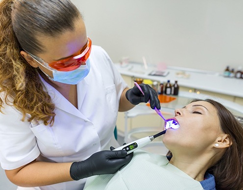 Woman at dentist benefiting from sedation dentistry 