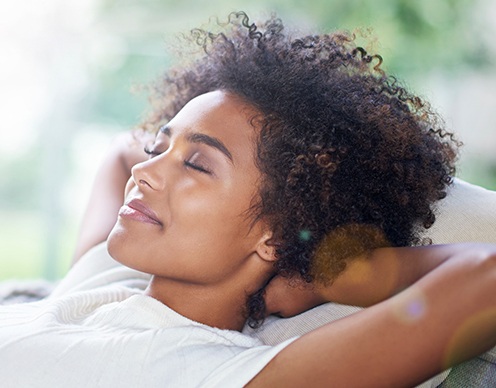 Patient relaxing after sedation dentistry treatment