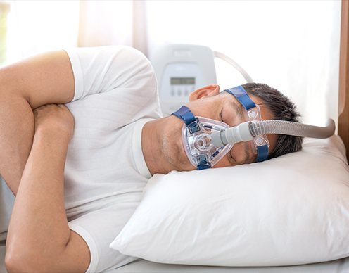 Man with CPAP system sleeping