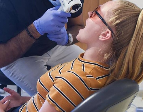 Patient receiving oral cancer screening