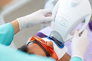 Patient receiving Zoom teeth whitening treatment
