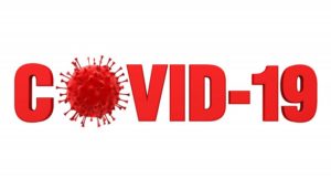 Text reading “COVID-19” with illustration of virus