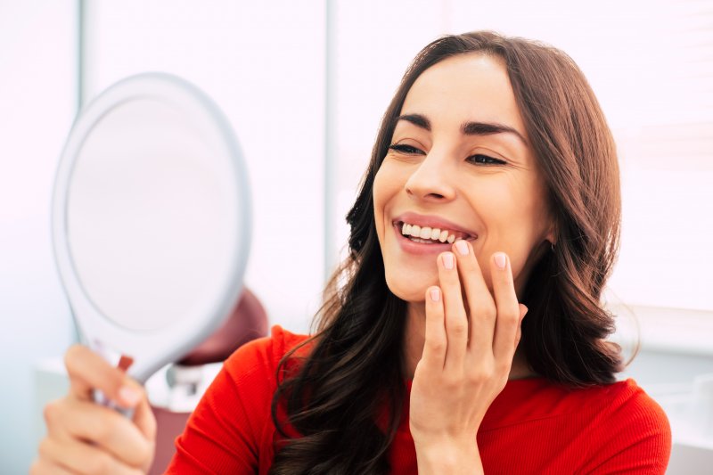 Woman smiling at her reflection